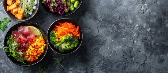 Wall Mural - Delicious poke bowls displayed on a textured gray background with copy space image