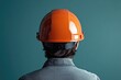 © MrHamster - Rear View of a Person Wearing an Orange Hard Hat