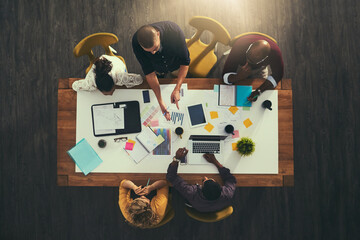 Poster - Top view, graphs or designers in meeting for discussion, teamwork or brainstorming in startup. Creative, documents or strategy with laptop, people or group with paperwork, budget report or feedback