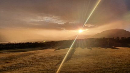 sunset through the clouds