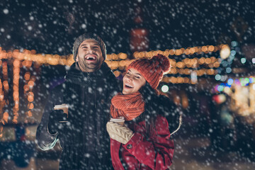 Poster - Photo of two people with hot beverage in hands spending x-mas evening together telling humorous jokes having best time wearing warm jackets