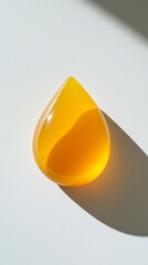 Aufkleber - Yellow glass teardrop on white surface, minimalist art concept