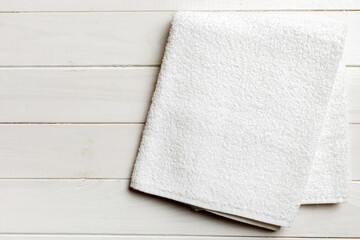 Wall Mural - Top view of white towels with copy space on colored background