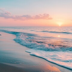 Poster - Peaceful sunset over a sandy beach with gentle waves crashing on the shore.