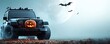 © Thitiphan - A close-up of a Halloween-themed safari vehicle, with a carved pumpkin on the hood and bats flying overhead against a full moon backdrop. The design leaves plenty of room for copy space.