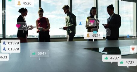 Poster - Animation of social media icon with numbers over diverse colleagues discussing work in office