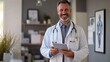 © fotofabrika - Friendly doctor smiling while holding a tablet in a modern medical office during daytime