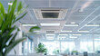 © Jirawatfoto - Modern office interior featuring ceiling air conditioning unit, bright lighting, and greenery. design promotes comfortable and productive work environment