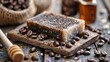© DELstudio - Handmade coffee soap on a wooden soap dish with coffee beans. Organic skincare and zero waste concept