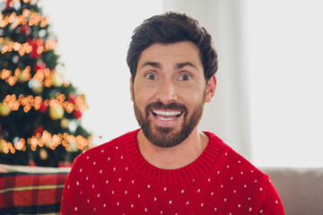 Wall Mural - Photo of nice young man toothy smile cant believe christmas atmosphere apartment indoors