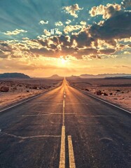 A stunning view of an endless desert highway stretching towards the horizon under a dramatic sky filled with clouds and a glowing sunset. This evokes themes of adventure, freedom, and travel.