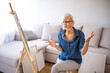 © Dragana Gordic - Senior Woman Enjoying Painting At Home On Canvas