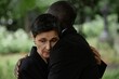 © Seventyfour - Portrait shot of sorrowful senior woman comforting husband with embrace grieving over loss of loved one during memorial ceremony at graveyard, copy space