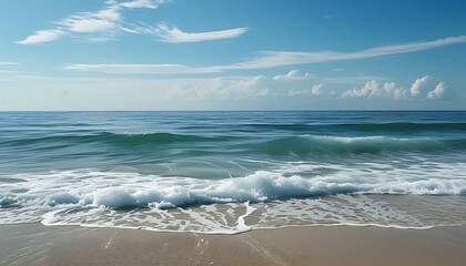 The calm and vast ocean meets the sky, and the waves gently beat the beach, presenting a peaceful and harmonious natural scene.