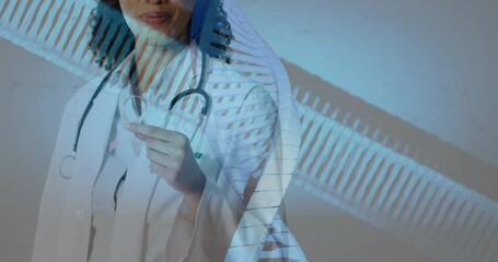 Poster - Animation of dna strands over african american female doctor holding pink ribbon