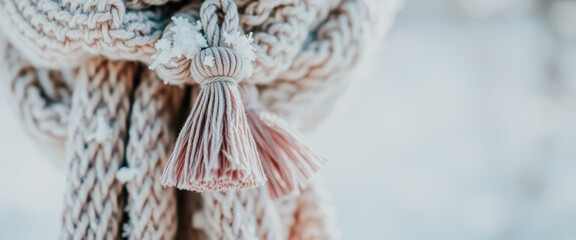 Wall Mural - Closeup of a Knitted Tassel with Snow