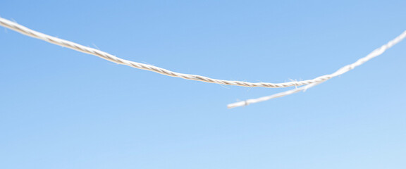 Sticker - Simple White Rope Against a Clear Blue Sky