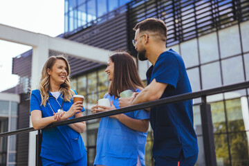 Healthcare Professionals Enjoying a Break Outside Hospital Building