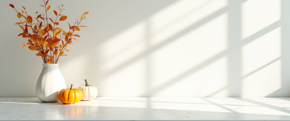 Canvas Print - White pumpkins, vase with fall leaves and shadow on white table