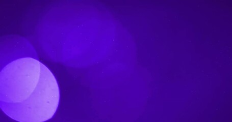 Poster - Animation of glowing light spots moving over purple background