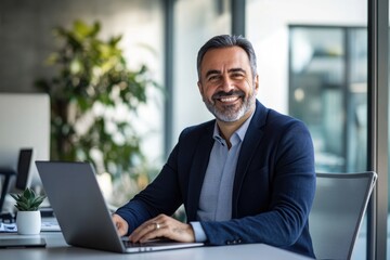 Portrait of a smiling  businessman sitting at a desk with a laptop in a modern office ,generative ai 