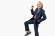 © somemeans - Portrait of a cute little boy in a suit on white background