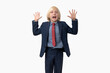 © somemeans - Surprised boy in a business suit with hands up Isolated on white background.