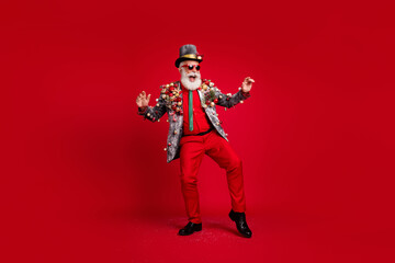 Sticker - Full length photo of nice aged elegant man dance cheerful wear christmas tree balls costume sunglasses isolated red color background