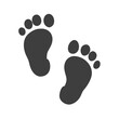 © Olga - Baby footprints icon, black silhouette, simple design