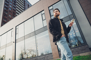 Aufkleber - Photo of attractive stylish man wear trendy clothes walk alone city street autumn day outside hold gadget