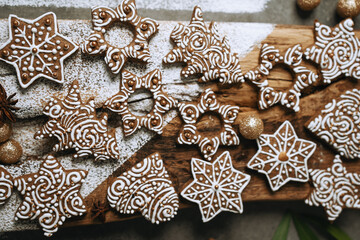 hand-decorated christmas cookies on a wooden background