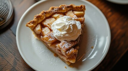 Sticker - A slice of apple pie topped with whipped cream, presented on a white plate.