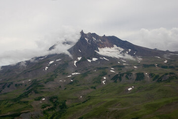 Canvas Print - Russia Kamchatka landscape with volcano on a cloudy summer day