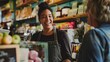 © Atiyut - A woman is smiling at a customer in a store