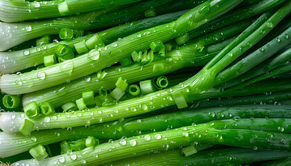 Wall Mural - Fresh green spring onions with water drops as background, top view