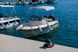 © aerogondo - Rental boat docked at a marina on a sunny day