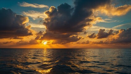 Sticker - Vibrant sunset over the ocean, with clouds glowing golden over the water.