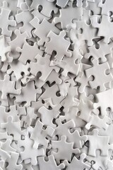 Poster - A stack of white puzzle pieces, ideal for illustrations and designs about building, construction, or problem-solving