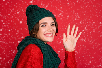 Sticker - Photo portrait young woman waving hand wearing knitted headwear scarf isolated vibrant red color background