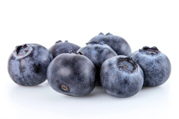 Poster - A pile of fresh blueberries arranged on a white surface, perfect for photography or illustration use
