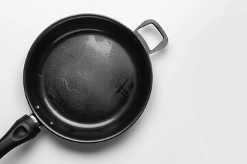 Poster - A close-up of a black frying pan placed on a white background