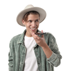 Poster - Young man in hat recording voice message via smartphone on white background