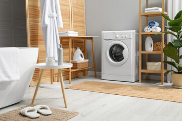 Wall Mural - Washing machine, towels and detergents in bathroom