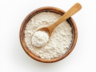 White powder in wooden bowl with brown spoon.