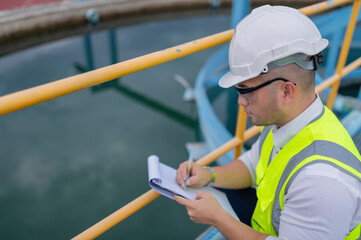 Wall Mural - Environmental engineers work at wastewater treatment plants,Water supply engineering working at Water recycling plant for reuse