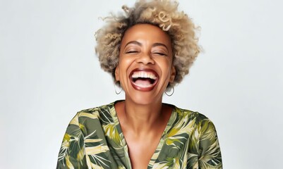 Wall Mural - Portrait of a happy young african american woman laughing on white background