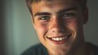 © PondLord - A young man with a friendly smile, showcasing clear skin and expressive eyes, placed in a minimalistic environment