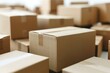 © Yuliia - close-up shot of a variety of cardboard shipping boxes against a clean white background.