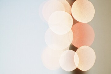 Poster - Abstract Blurred Round Bokeh Lights in Warm Tones on White Background