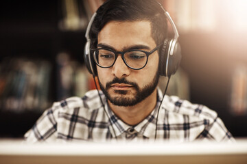 Poster - Computer, headphones and Indian man in library for research, elearning and education at university. Reading, study and college student on campus streaming online course, class or webinar in earphones